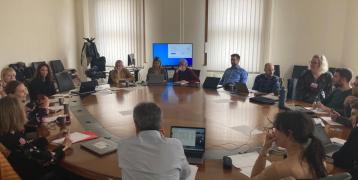 kink off meeting in Florence May 10th people aroun t a table discussing about renewable energy communities